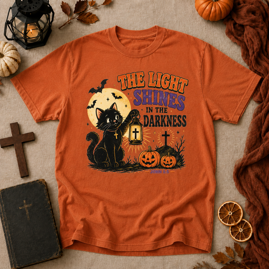 Halloween Cat T-Shirt — "The Light Shines in the Darkness" Vintage Christian Pumpkin Tee